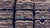 Green coffee bags stacked on pallets in a warehouse