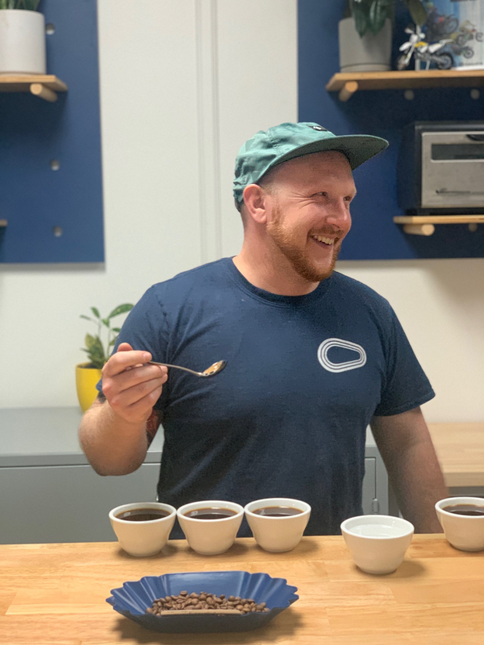 Luke Hales cupping coffee at Hacea Coffee Source